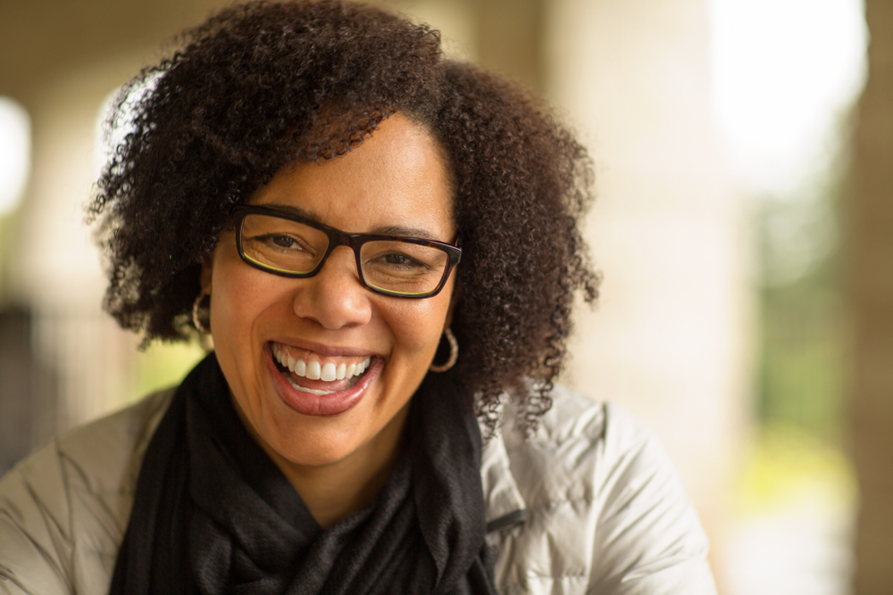 A young woman smiles after visiting her Philadelphia family dentist. 